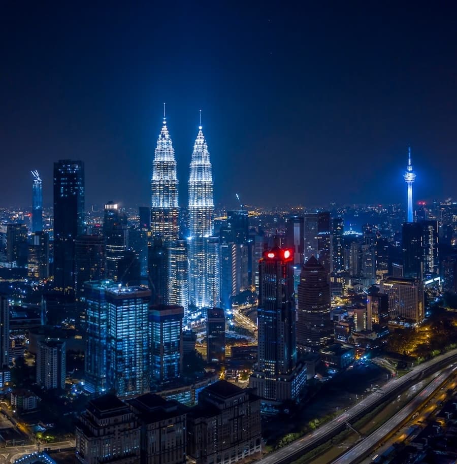 Kuala Lumpur night skyline showcasing the illuminated Petronas Twin Towers, location of our Southeast Asian CDN node for optimized content delivery.
