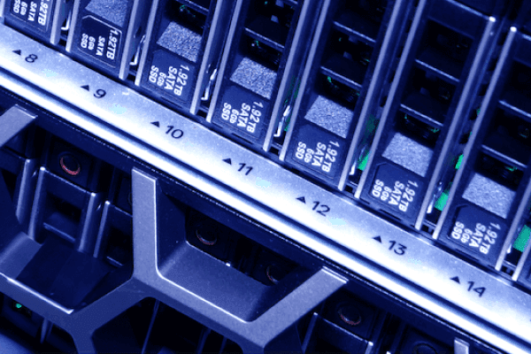 Illustration of blue and white computer servers stacked together, showing data storage units with cooling fans on top. The image conveys technology and organization.