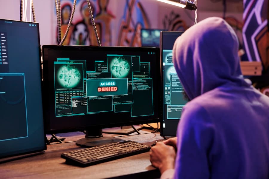 Cybersecurity specialists analyzing digital threat data on screen, showcasing our advanced ransomware mitigation services.