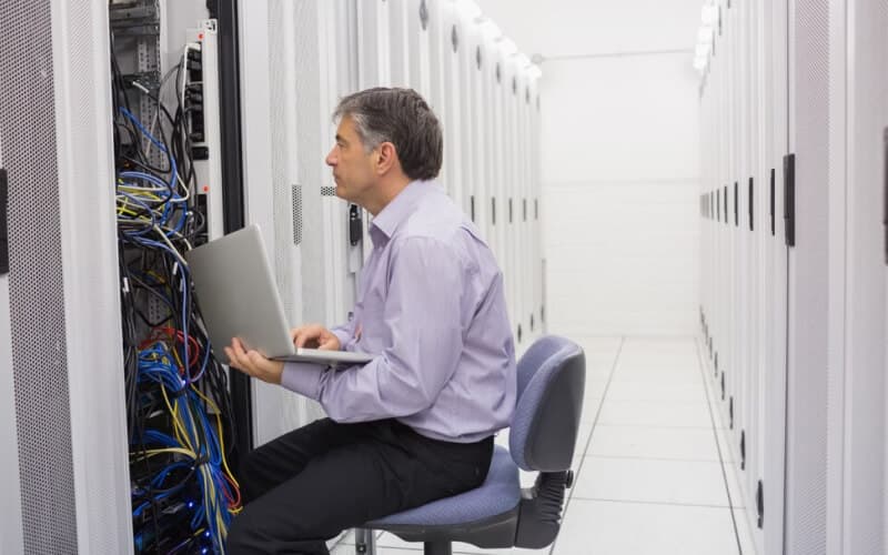 Technician controlling the server with a laptop.