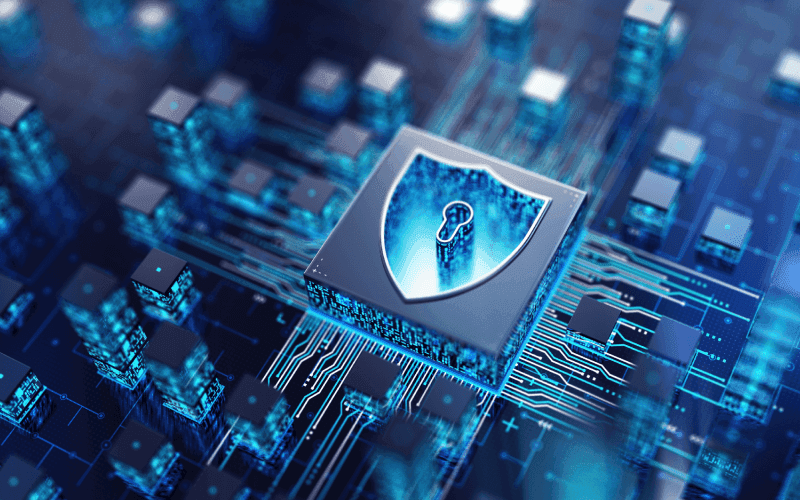 A digital circuit board with a central shield icon containing a keyhole, symbolizing cybersecurity. The blue tones convey a high-tech, secure atmosphere.
