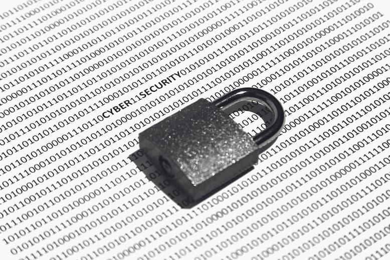 Closeup shot of a lock on a white surface with binary code on it.